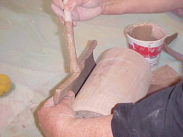 Putting slip on bevel of slab