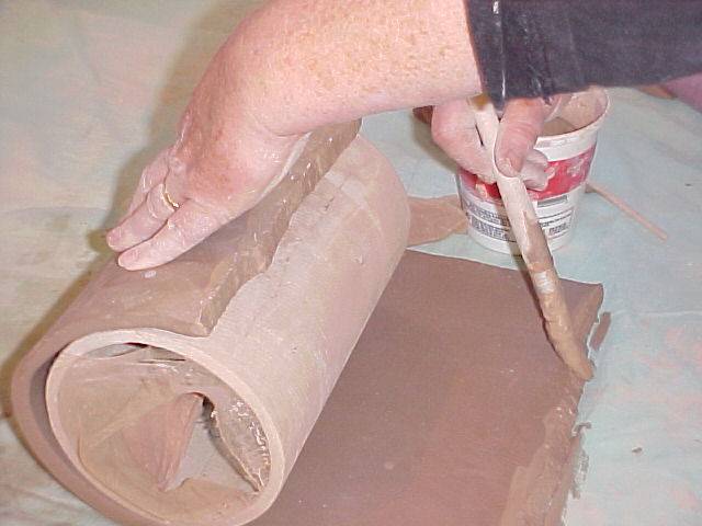 Putting slip on bevel of slab