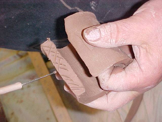 Scoring seam on  spout